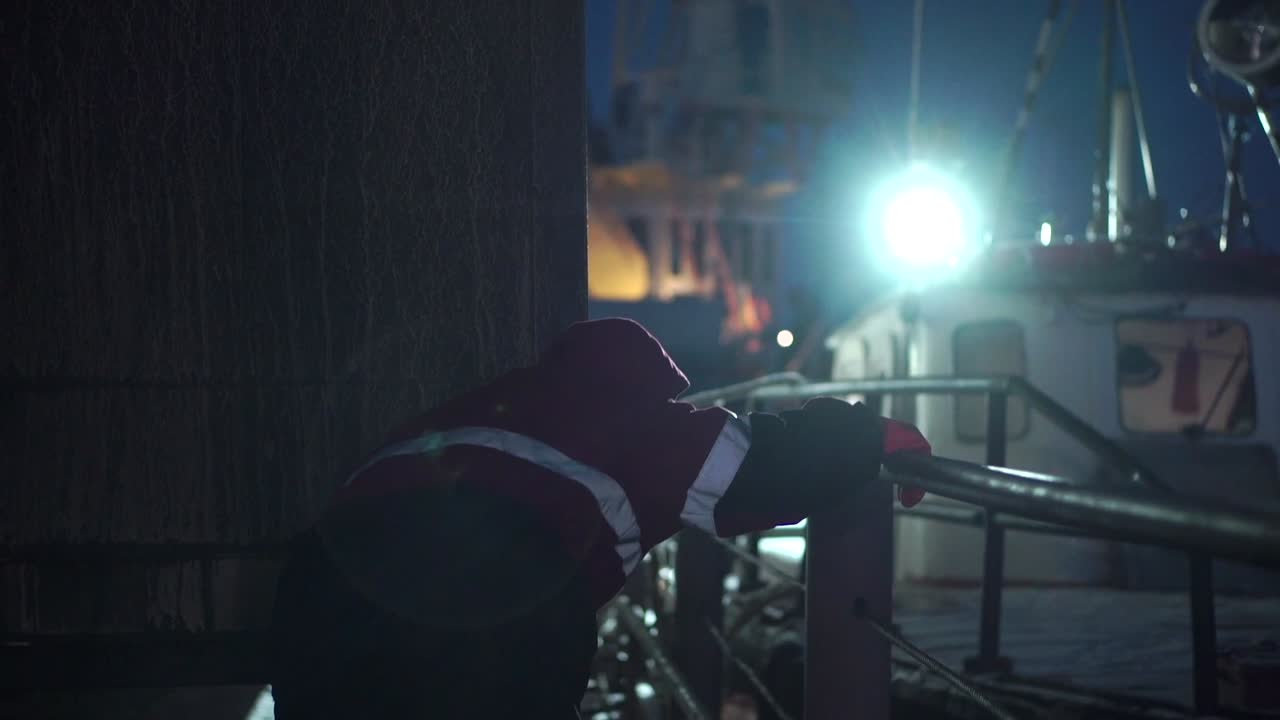 Night worker at the fishing dock