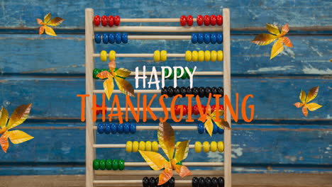 Animation of happy thanksgiving text over autumn leaves and abacus on wooden boards
