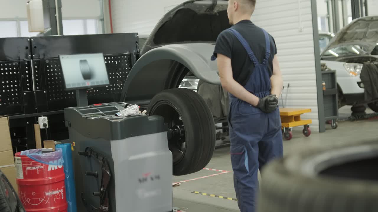 Tire balancing in auto repair shop