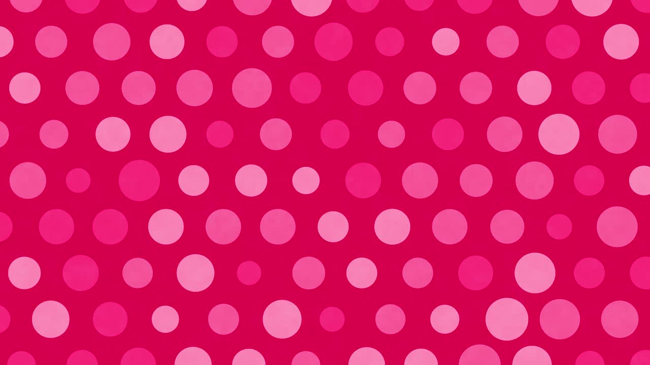 Red polka dots move on a background.