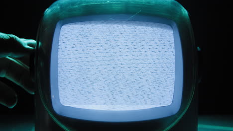 retro tv, vintage television in a nostalgic setup, a retro tv displays grain on screen, scary halloween night device good for chroma key and green screen. high quality 4k footage