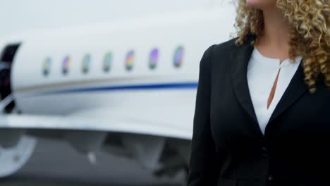 businesswoman standing on a runaway 4k