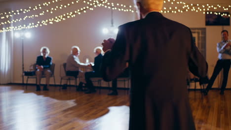 senior couple dancing at a celebration