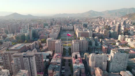 dolly out aerial view of paseo bulnes and la moneda palace, in the civic quarter of santiago, chile