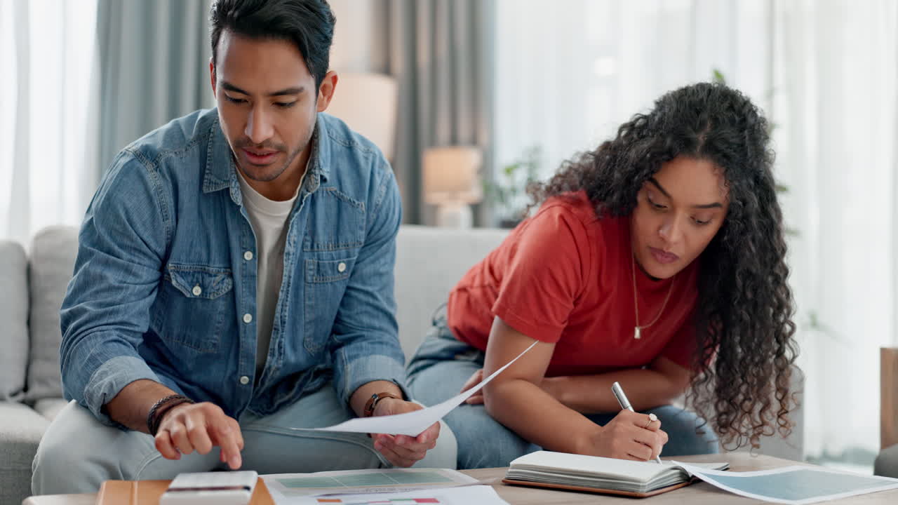 Couple, calculator and home budget
