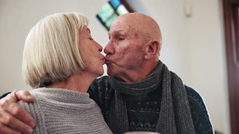 Kiss,-elderly-couple-and-coffee-in-home