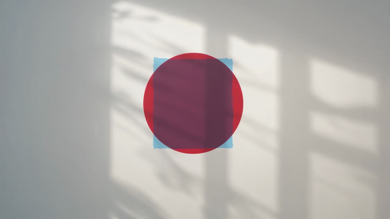 Displaying red circular graphic at clip start over light blue square on wall, with window shadows