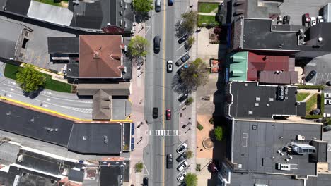 Aerial-top-down-shot-of-traffic-on-main-street-of-american-town