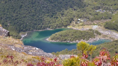 Slider,-revealing-Lake-McKenzie-hut-in-the-valley-below,-Routeburn-Track-New-Zealand