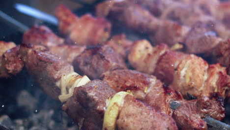 cooking kebab on skewers. cooking lamb meat on hot charcoal.