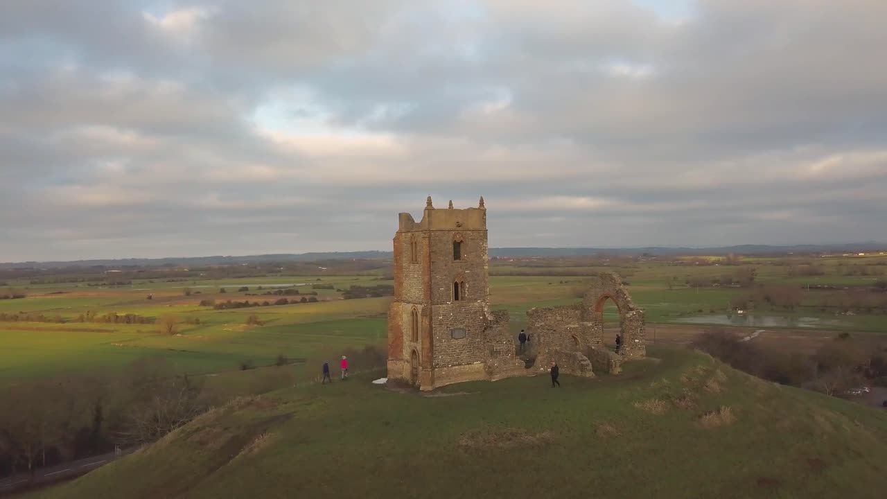 BURROWBRIDGE, SOMERSET, ENGLAND, December 29, 2019: Aerial view of Burrow Mump ruins church with flooded fields on the background.