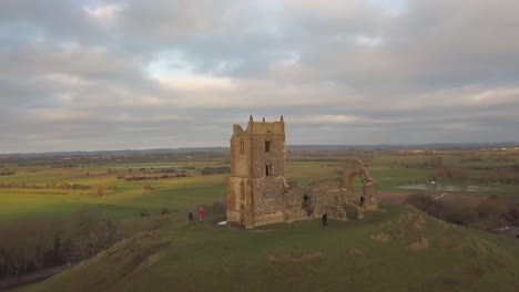 burrowbridge, somerset, england, december 29, 2019: aerial view of burrow mump ruins church with flooded fields on the background.