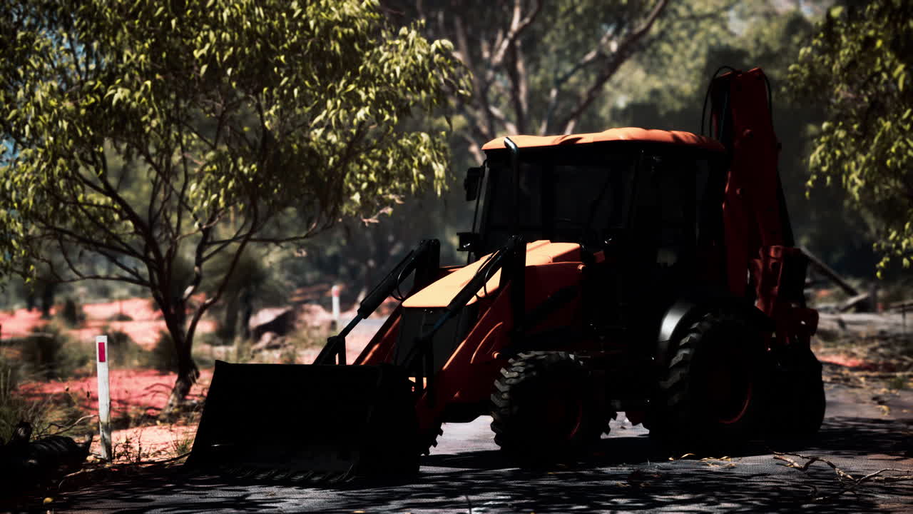 덤불 숲 에 있는 발굴기 트랙터