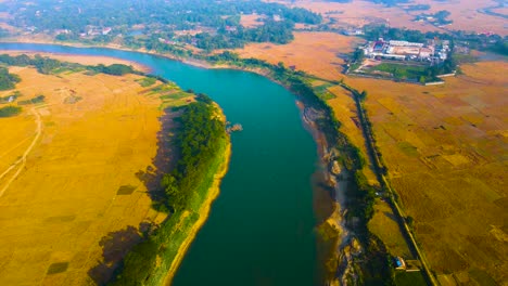 surma river in bangladesh, fertile agriculture land during harvest season