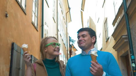 couple walking and eating ice-cream