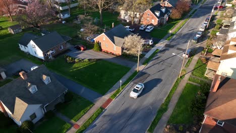 Residential-American-Neighborhood-in-Spring,-Aerial-View-of-Houses,-Cars,-Roads-of-Urban-United-States-Cityscape,-Drone-Tracks-Automobile