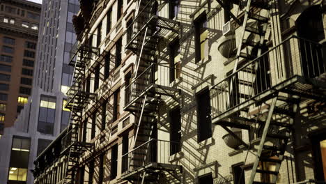 urban architecture showcases fire escapes and shadows at twilight hour