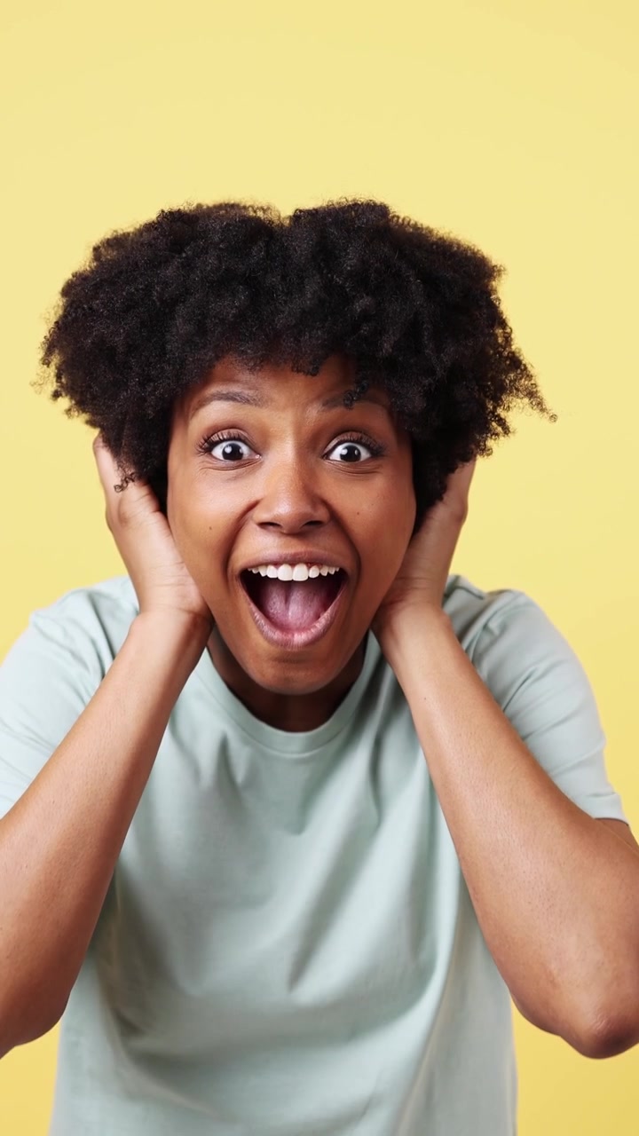 Happy African American Woman Reacting with Surprise and Excitement