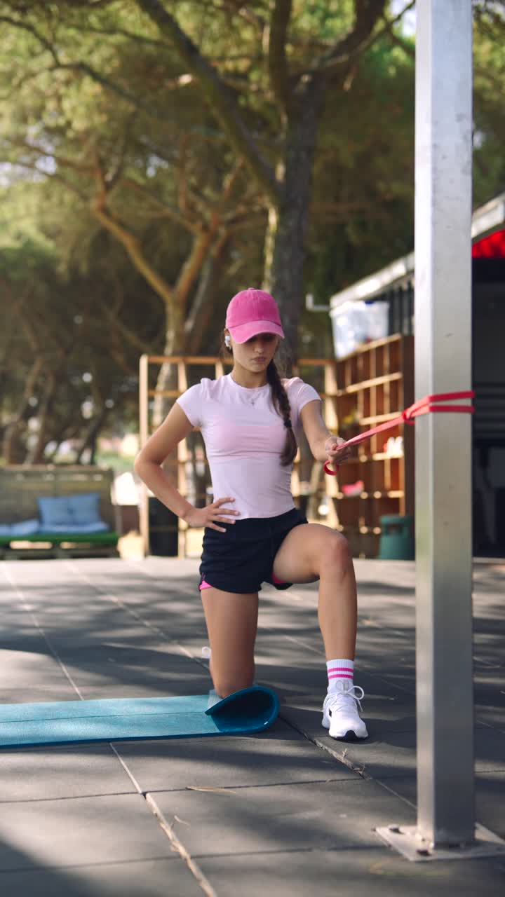 Woman doing outdoor workout with resistance band