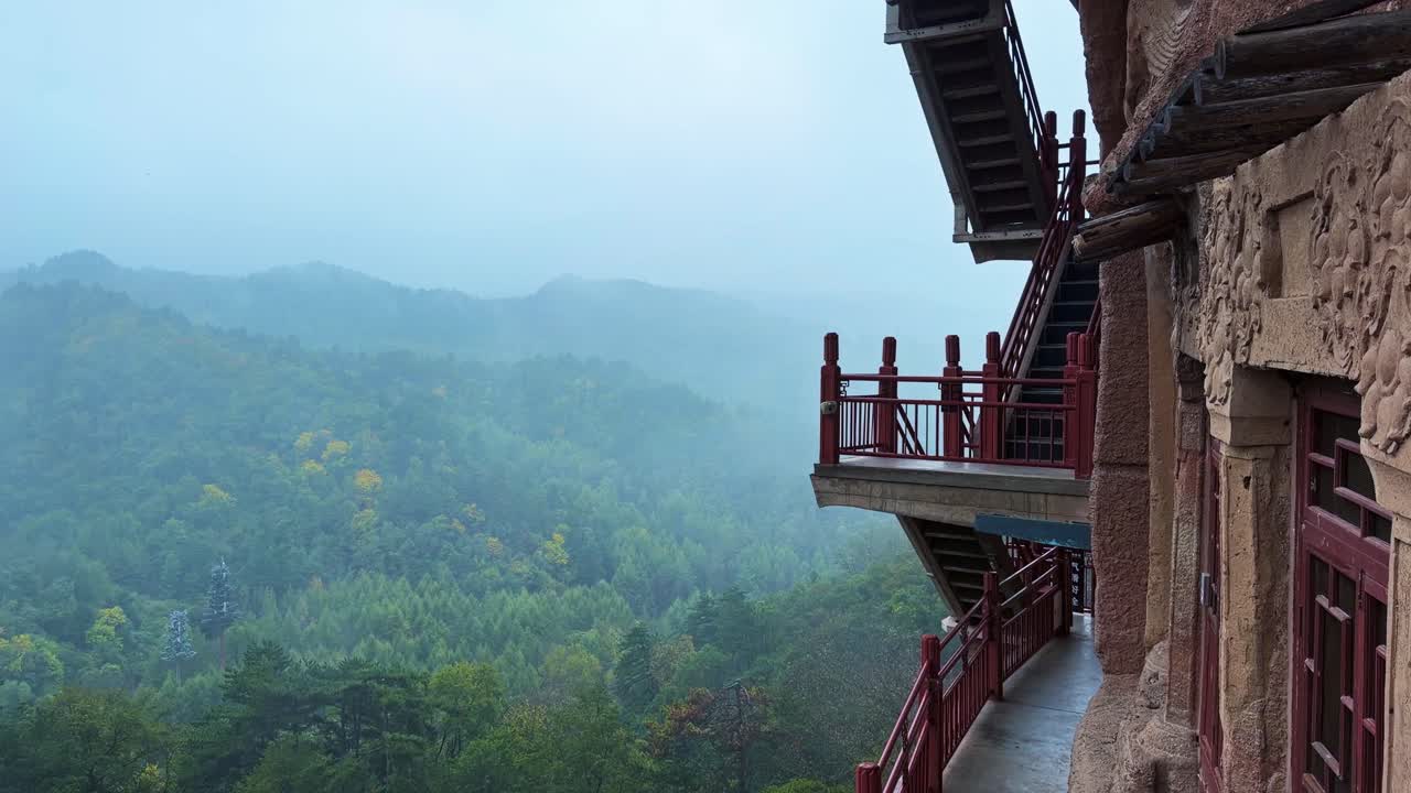 Wooden Walkways And Stairs Onto The Cliff Face At Maijishan Grottoes Near Tianshui City in China's Gansu Province. Pan Right Shot