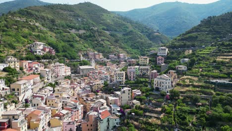 riomaggiore village and colorful houses in cinque terre, vernazza, la spezia, liguria, italy - aerial 4k