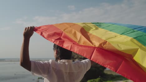 pride flag at the beach
