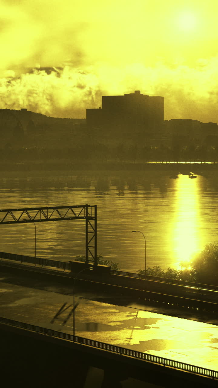 Golden sunset reflection over river with city skyline and highway