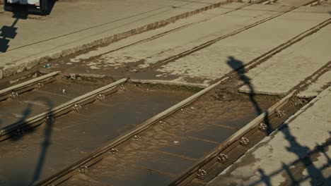 mud covered tram tracks left behind after floodwaters receded during the budapest flood 2024