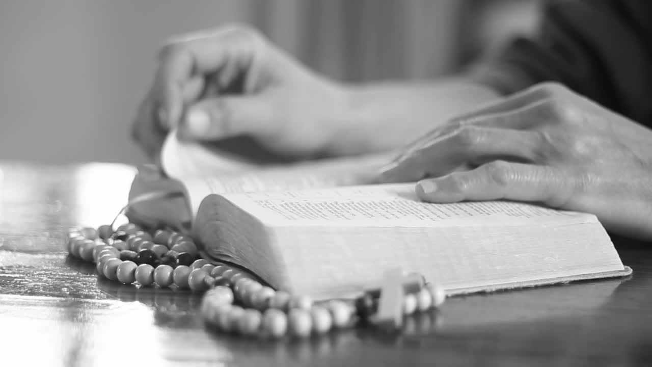 Christian people praying woman praying with cross and bible hands together people in video stock video stock footage
