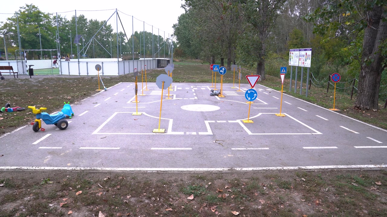 Children's traffic training area with toy tricycle teaching road safety