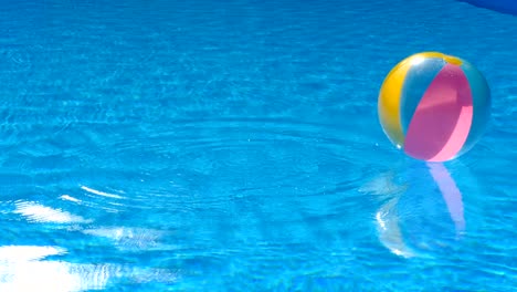 beach ball floating in pool