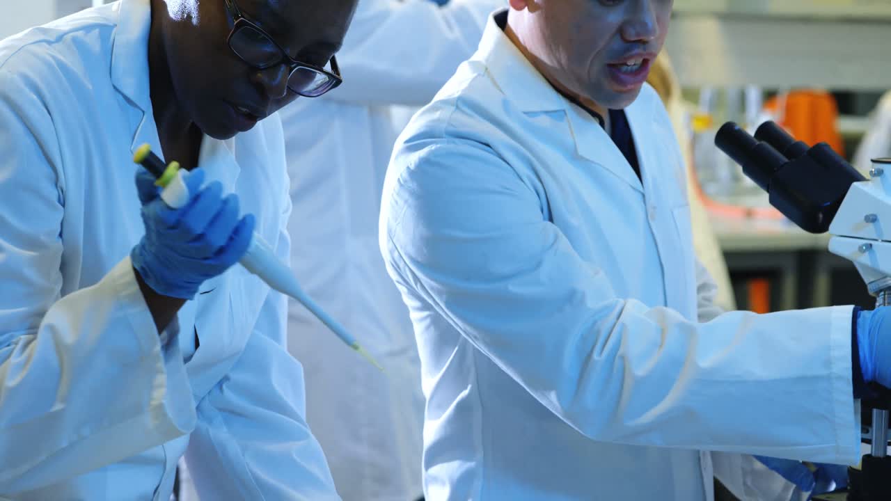 Scientists experimenting in laboratory 4k