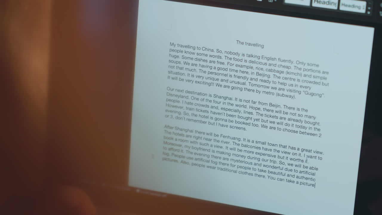 Silent editing by dim lamp. Careful manuscript examination under amber light in quiet atmosphere. Meticulous reading and editing performed late at night with gentle ambient lighting