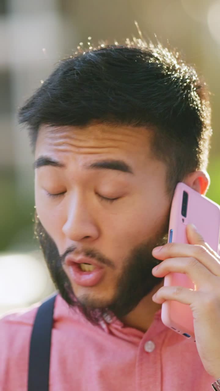 Man talking on a pink phone