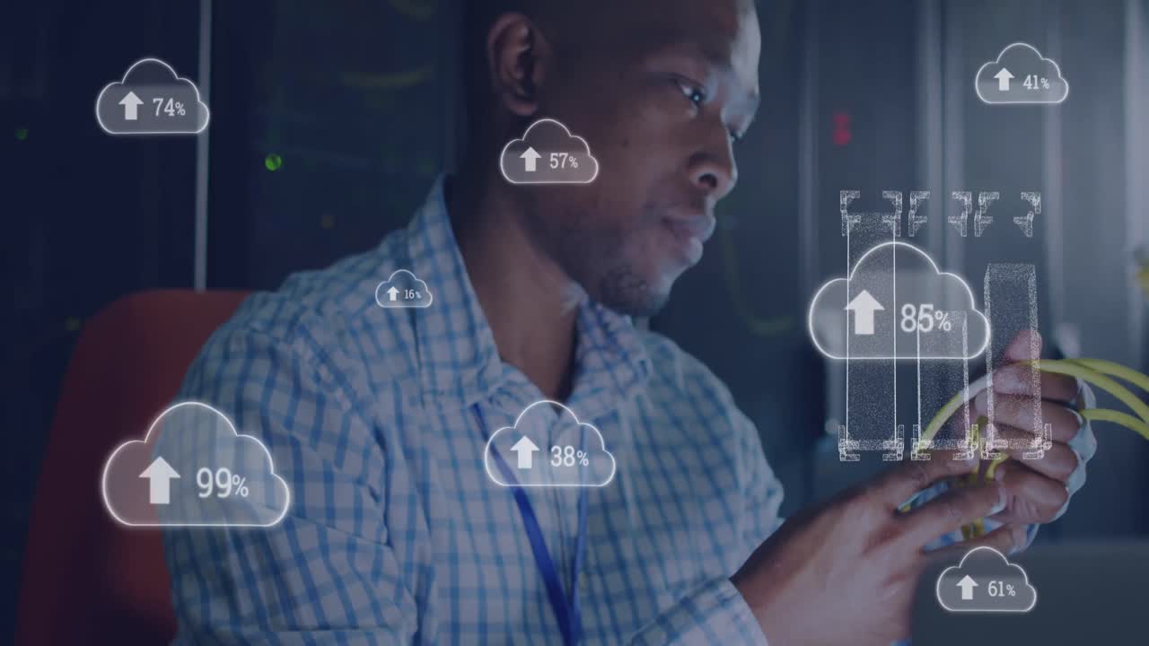 Animation of cloud with uploading over african american man working in server room