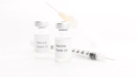 covid-19 vaccine and syringe