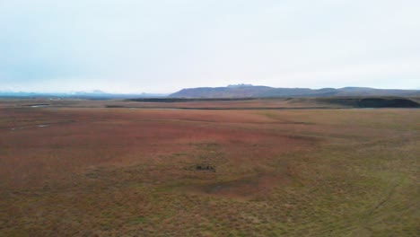 vast windswept plains in grassy nordic landscape in iceland, drone