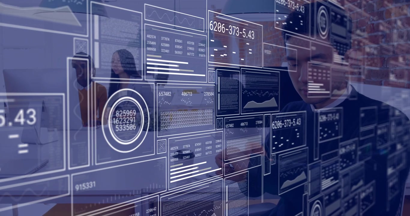 Analyst typing, team consulting monitor, holographic data panels overlaying scene for tech analysis