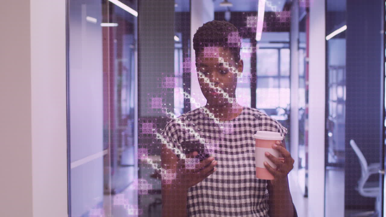 Animation of dna strand over african american businesswoman