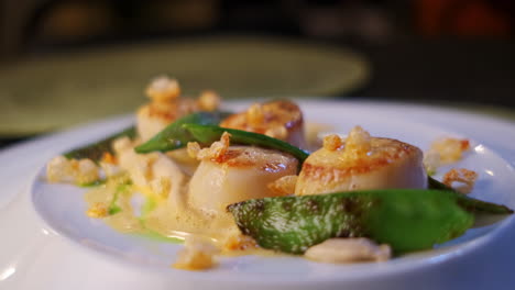 close-up of fine spanish delicacies nicely put together on a plate in a restaurant