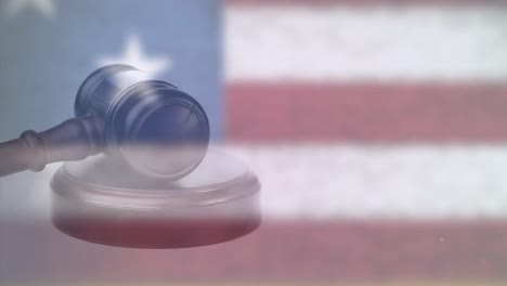 composite video of gavel spinning against american flag in background