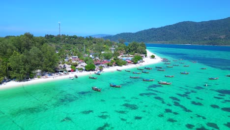 dream-beach-longtail-boats-in-turquoise-water