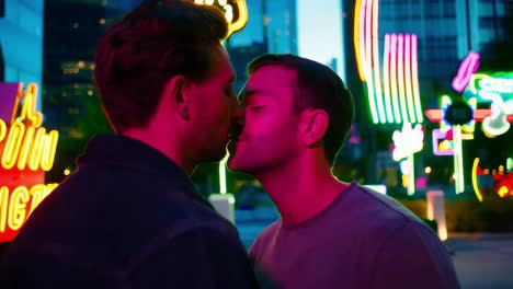 two men kissing at night in a city with neon lights