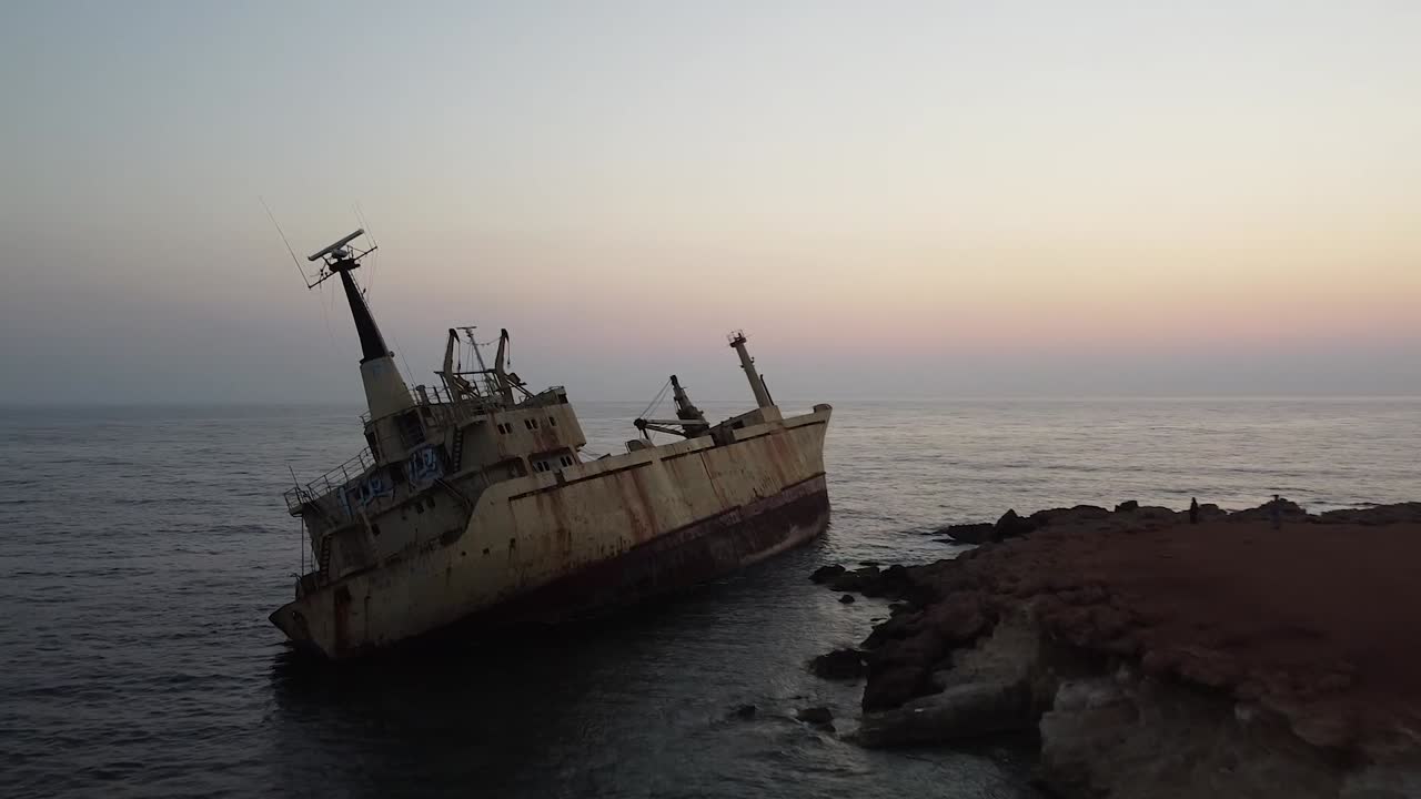 Old drowned and abandoned ship thrown out to the beach. Unique place, especially during sunset. Nice colors, view, sound and atmosphere.