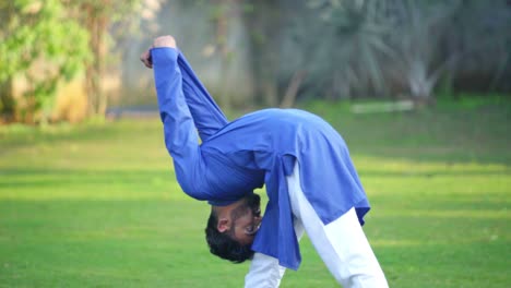 indian man doing pyramid yoga pose