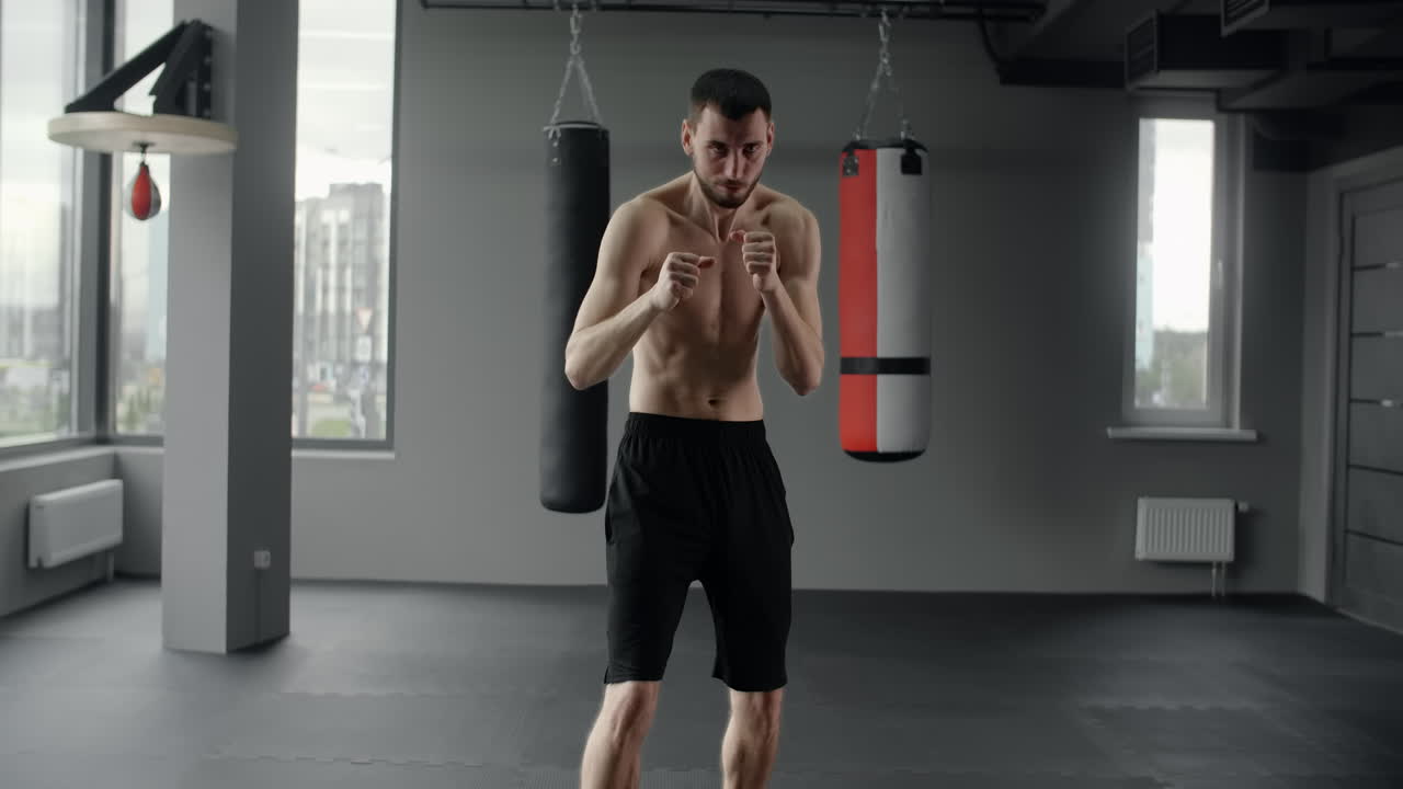 Man training boxing in a gym