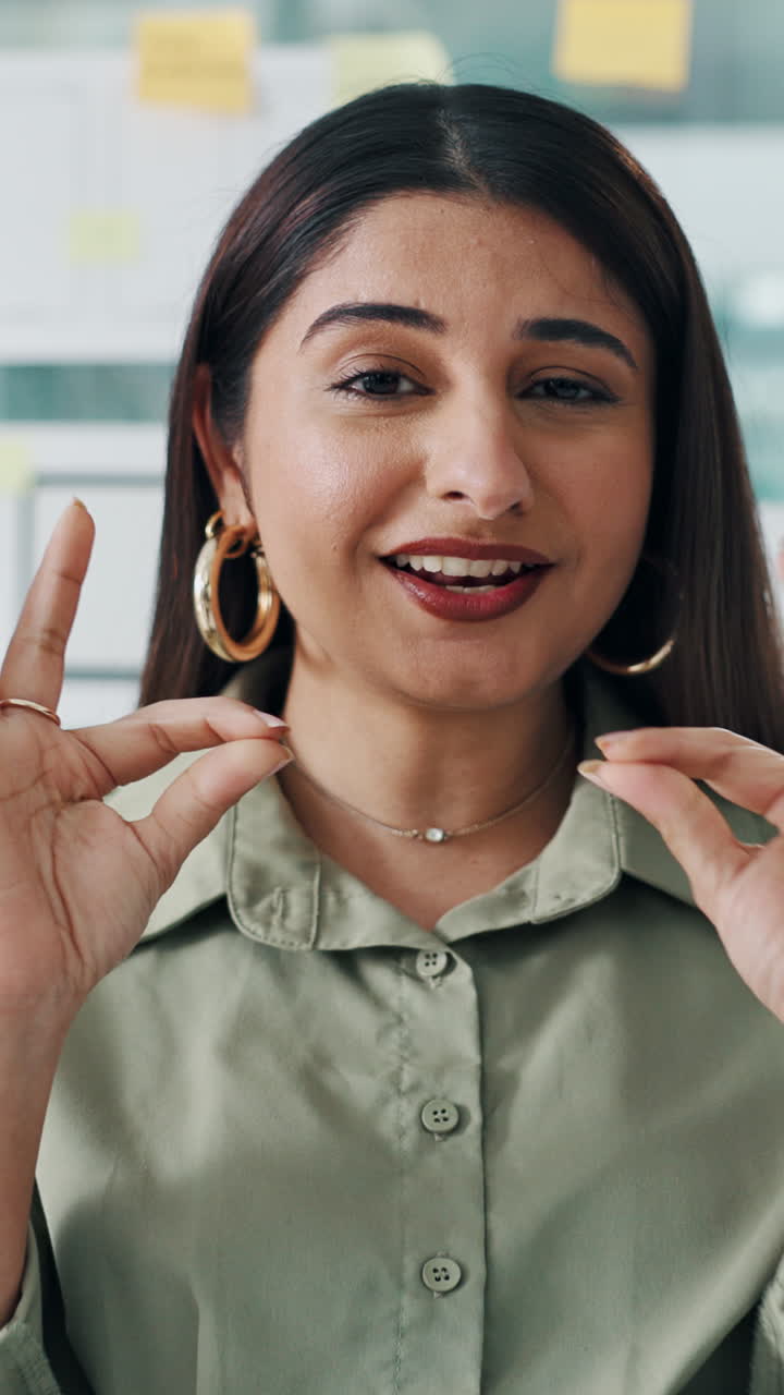 Young Woman Talking and Gesturing in a Professional Setting