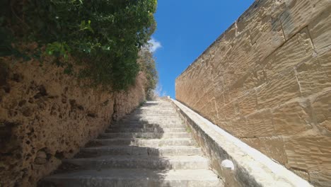 walking up the stone stairs on a sunny day