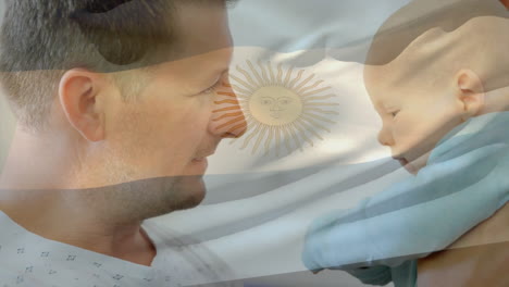 animación de la bandera argentina sobre el feliz padre caucásico sosteniendo al bebé