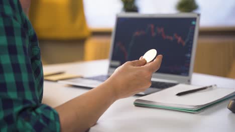 woman examining bitcoin.